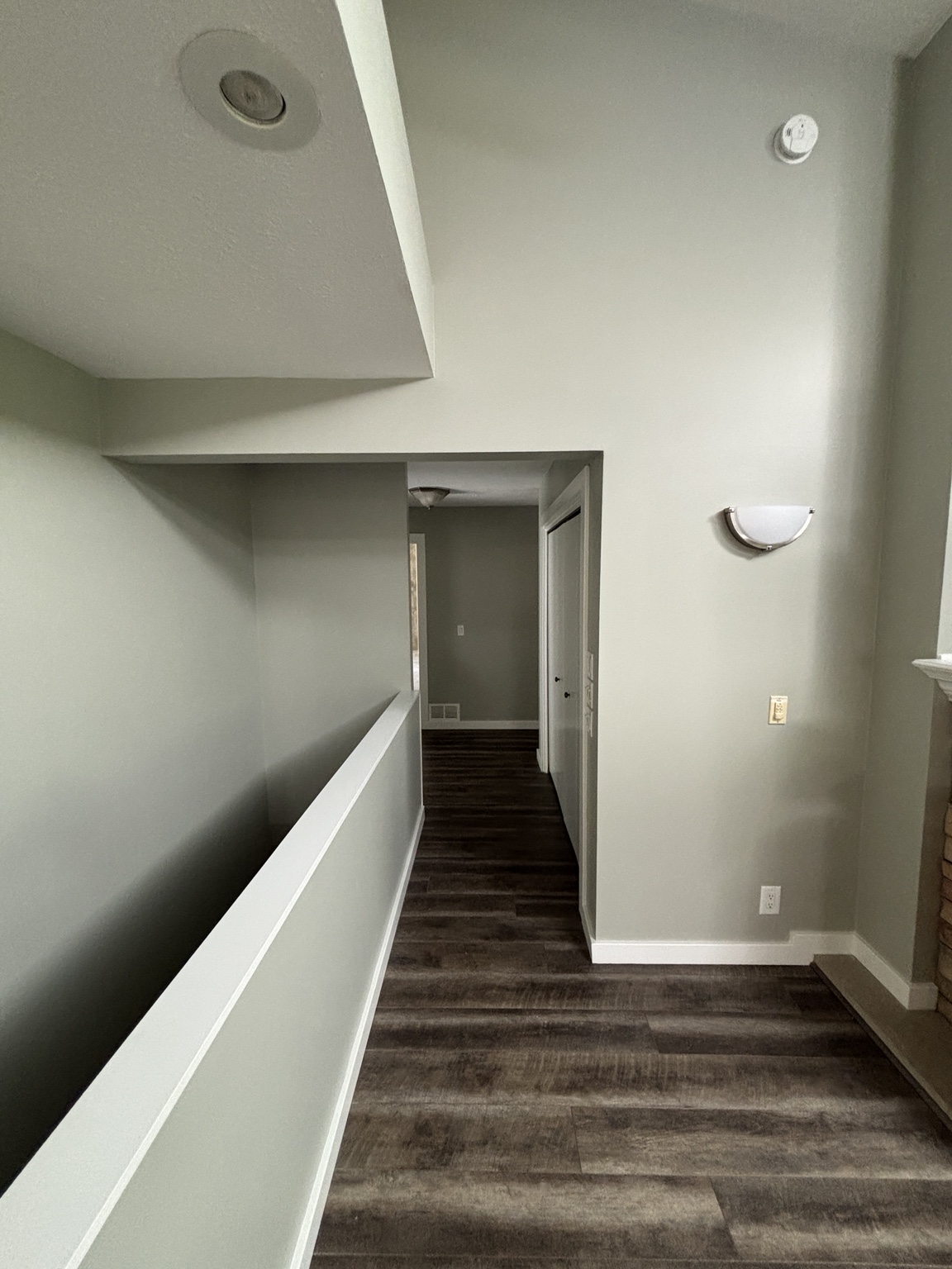 Finished gray hallway with crisp white trim